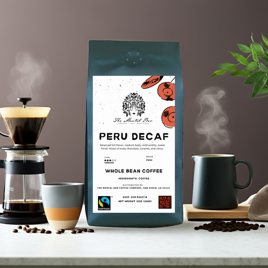 Peru Decaf coffee package on a table with coffee-making equipment and beans
