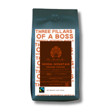 Coffee bag with 'Three Pillars of a Boss' branding on a white background