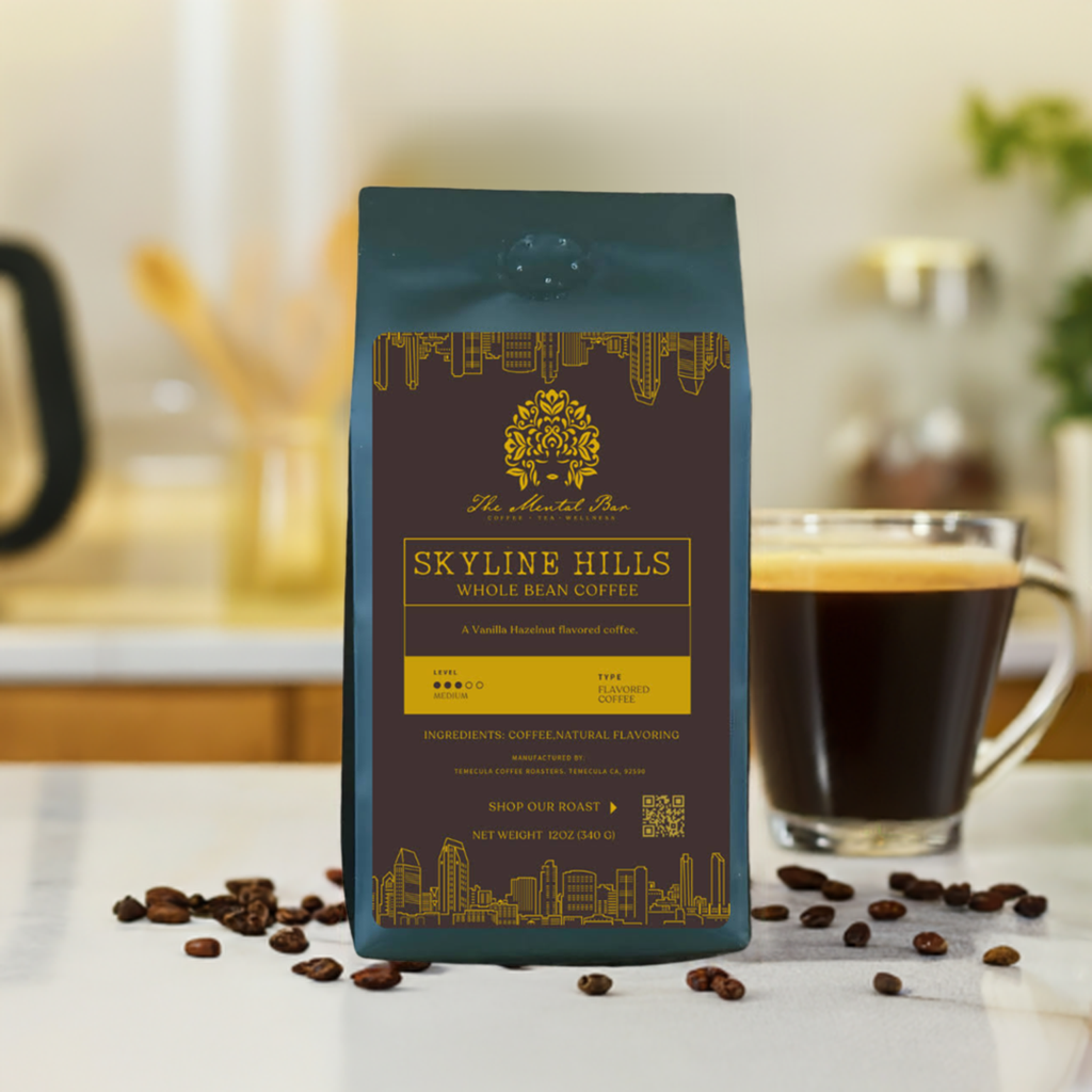 A pack of Skyline Hills flavored coffee, medium roast, with vanilla hazelnut flavor, displayed on a kitchen counter with a cup of coffee and coffee beans scattered around.